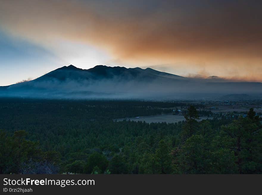 San Francisco Peaks. Day 4 of the Schultz Fire, Flagstaff, Arizona. At this point, the fire has consumed over 12,000 acres, including parts of the Schultz Pass area and northern flanks of the Dry Lake Hills, and most of the eastern side of the San Francisco Peaks. San Francisco Peaks. Day 4 of the Schultz Fire, Flagstaff, Arizona. At this point, the fire has consumed over 12,000 acres, including parts of the Schultz Pass area and northern flanks of the Dry Lake Hills, and most of the eastern side of the San Francisco Peaks.