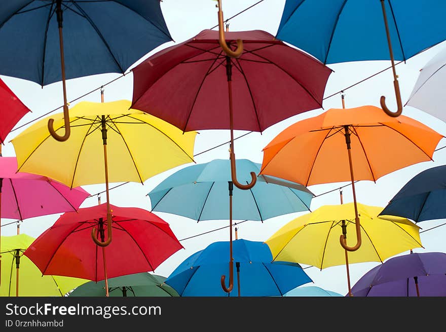 Colorful umbrella suspended in the street