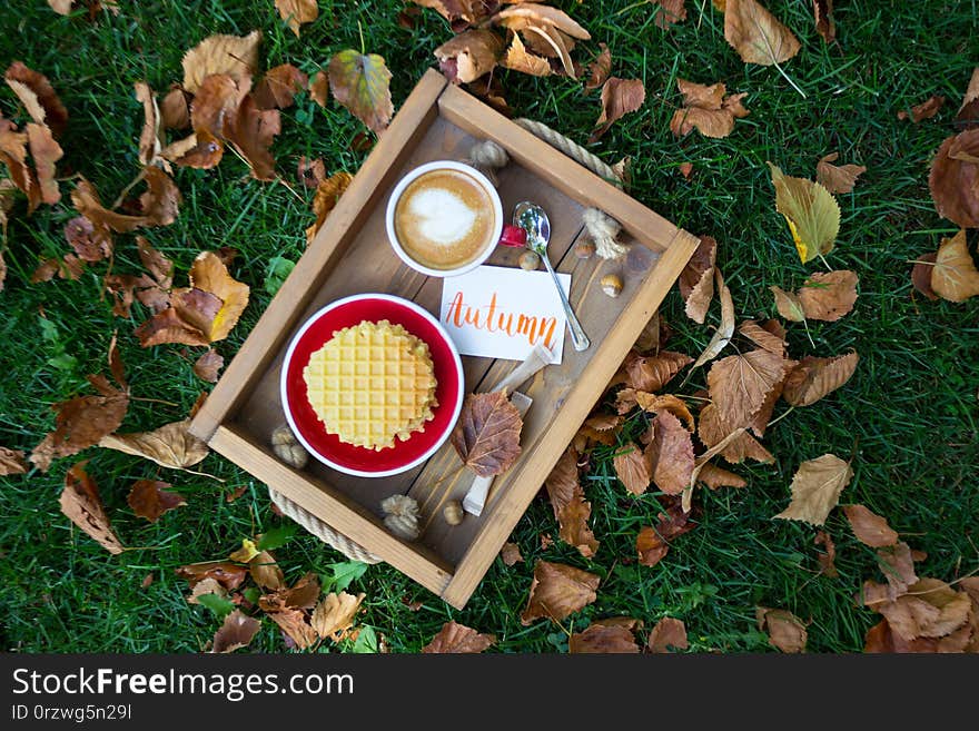 Breakfast - waffles and cup of coffee on a wooden tray. inscription autumn