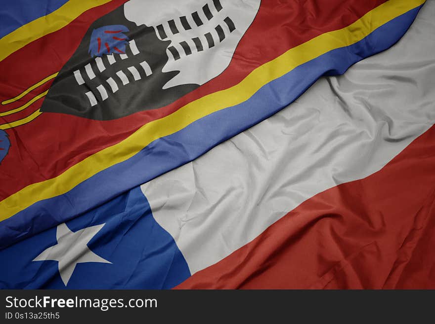 waving colorful flag of chile and national flag of swaziland. macro