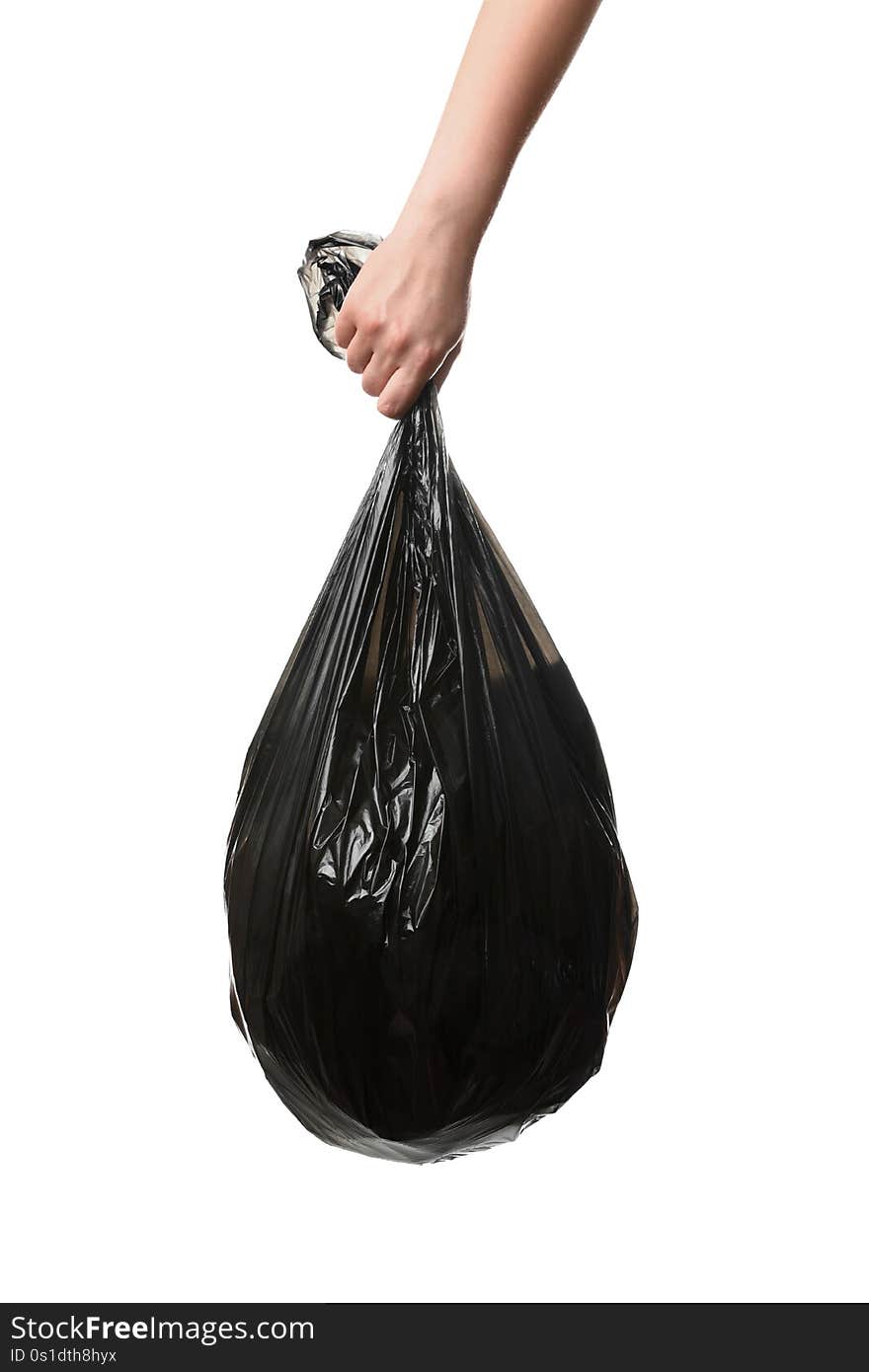 Woman holding bin bag full of garbage on white background. Recycling concept