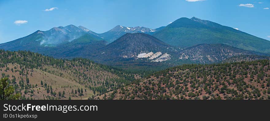 View from the road up Robinson Crater. A week after the Schultz Fire began, the wildfire is mostly contained. Clear skies and little smoke provided excellent visibility of the damage to the eastern face of the San Francisco Peaks. View from the road up Robinson Crater. A week after the Schultz Fire began, the wildfire is mostly contained. Clear skies and little smoke provided excellent visibility of the damage to the eastern face of the San Francisco Peaks.