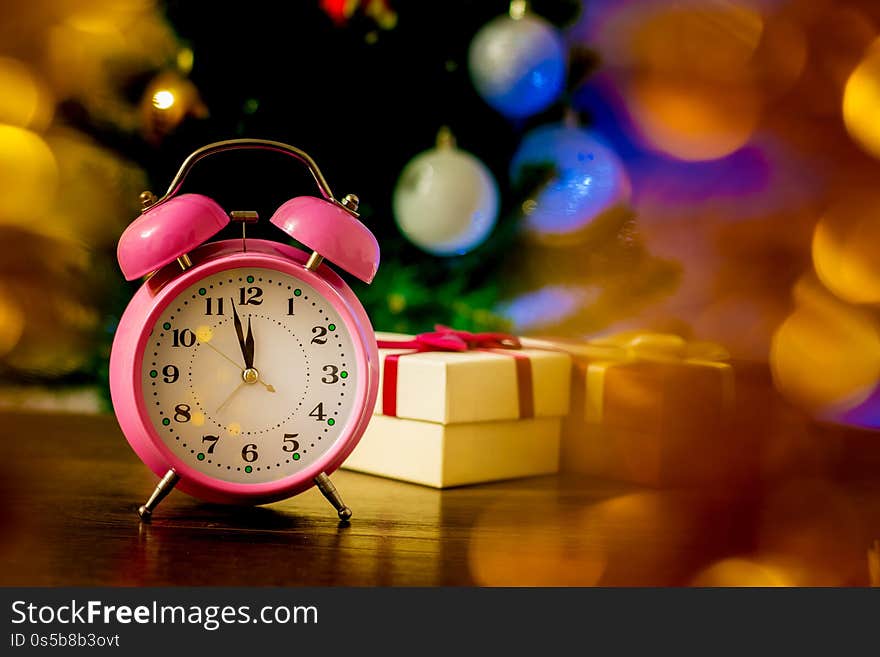 Clock And Gift Boxes Near Christmas Tree On New Year`s Eve_