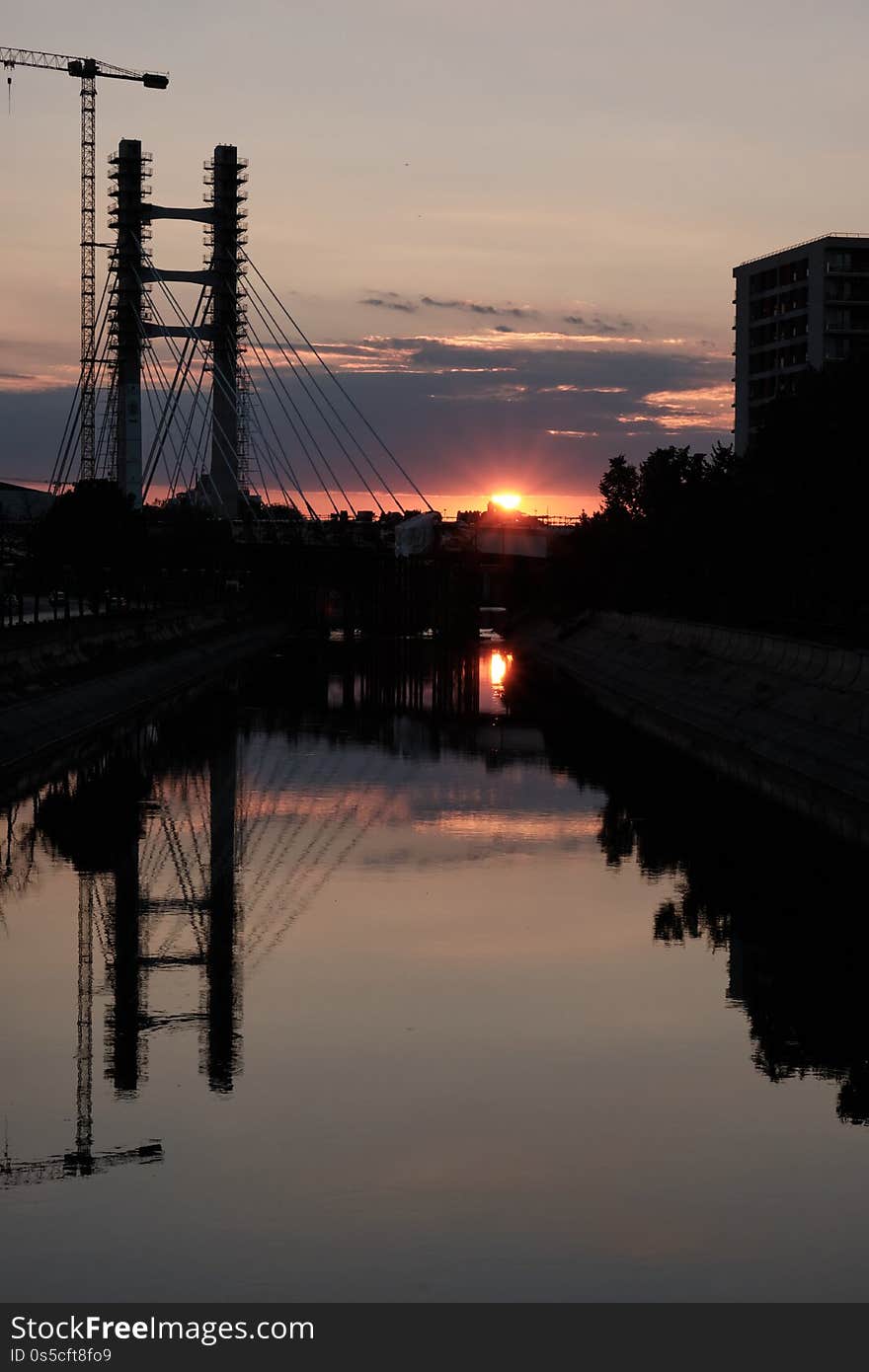 The new bridge yard at sunset with beautiful light and mirrored in the river.