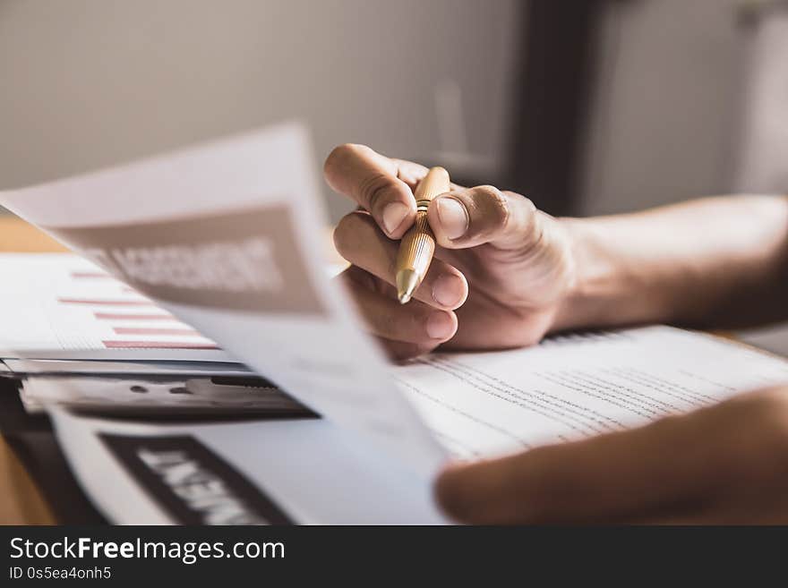 Businessman Or Lawyers Sitting Office Signing Contract Papers On Wood Table. Law Of Advisor Concepts And Vintage, Sunset Light.