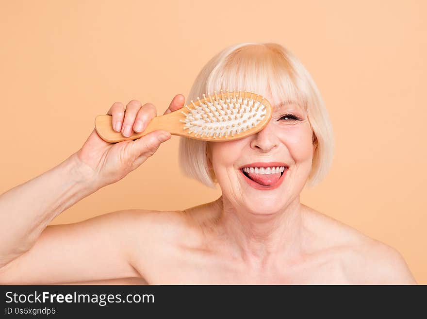 Close-up portrait of her she nice attractive nude naked well-groomed, cheerful cheery positive crazy foolish gray-haired lady having fun isolated over beige background. Close-up portrait of her she nice attractive nude naked well-groomed, cheerful cheery positive crazy foolish gray-haired lady having fun isolated over beige background