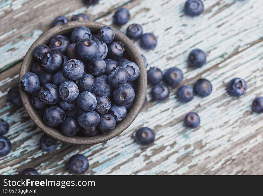 Ripe Blueberry Berries On Old Wooden Table