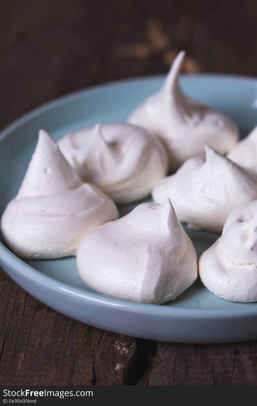 mouth-watering meringue on wooden background