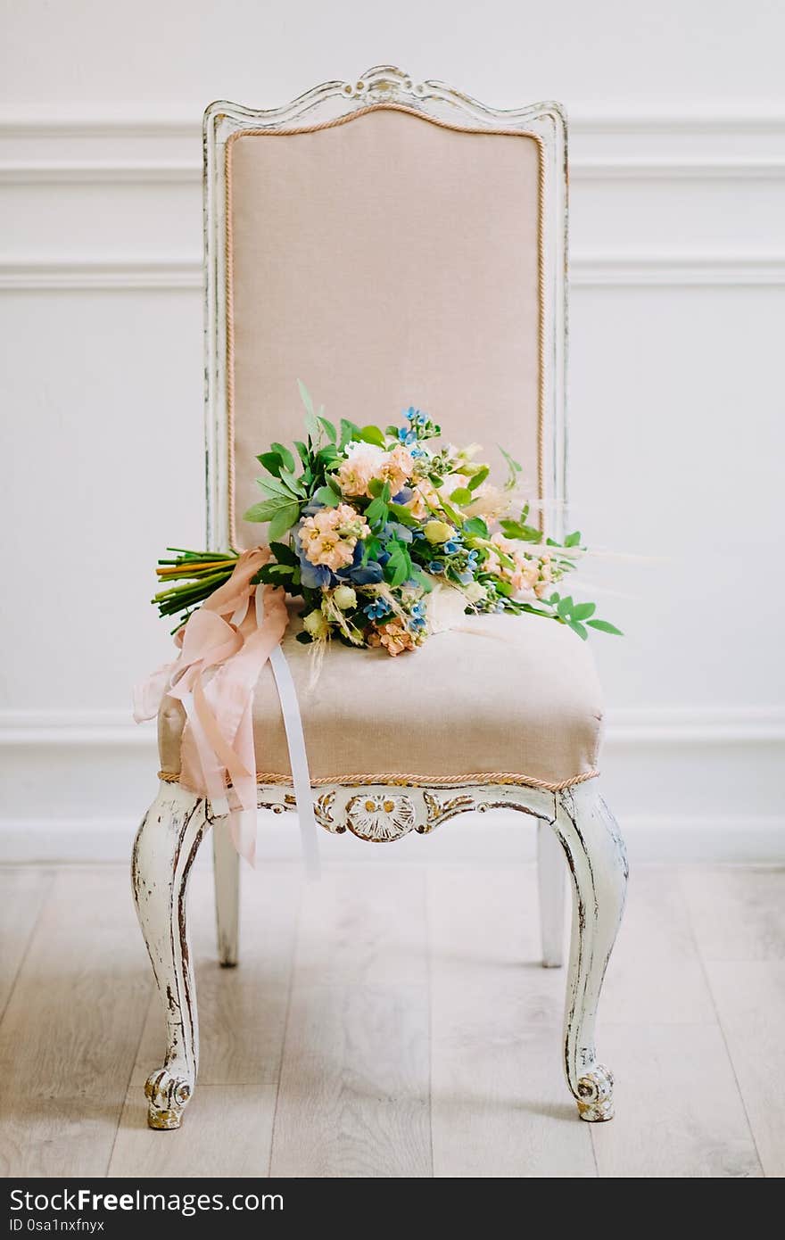Beautiful wedding bouquet of different flowers on a chair. Beautiful wedding bouquet of different flowers on a chair