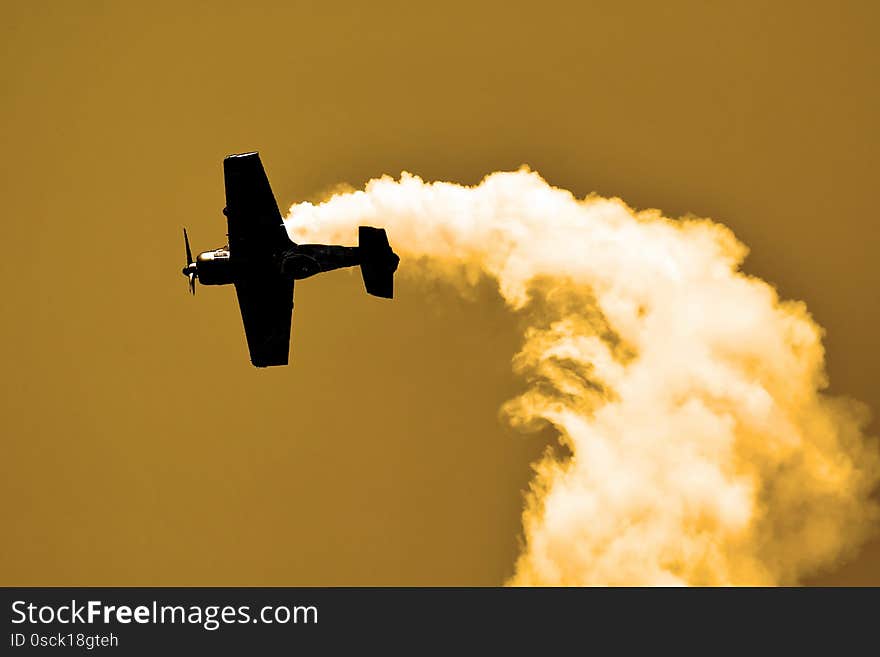 Airplane flying in the sunset at airshow