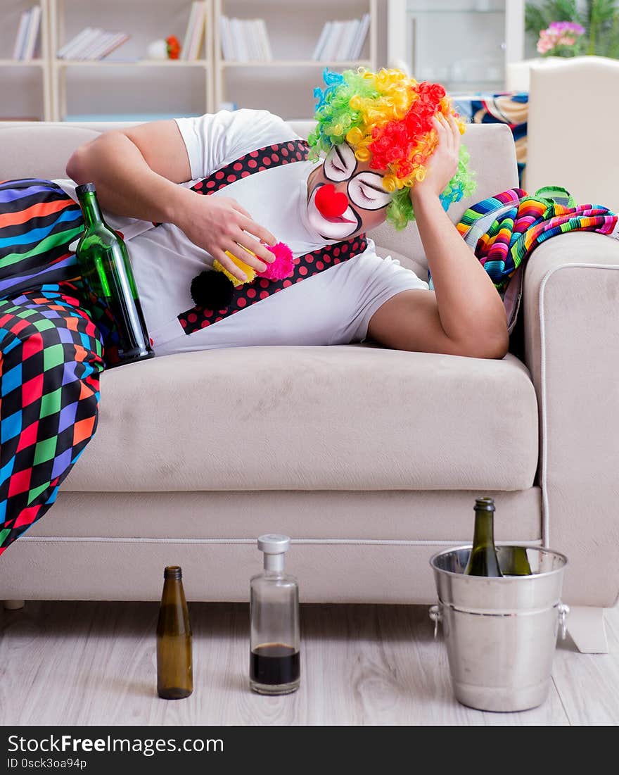 Drunk clown celebrating having a party at home