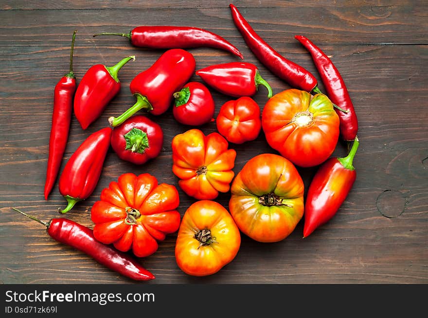 Assortment of organic vegetables on wooden background. The concept of healthy eating