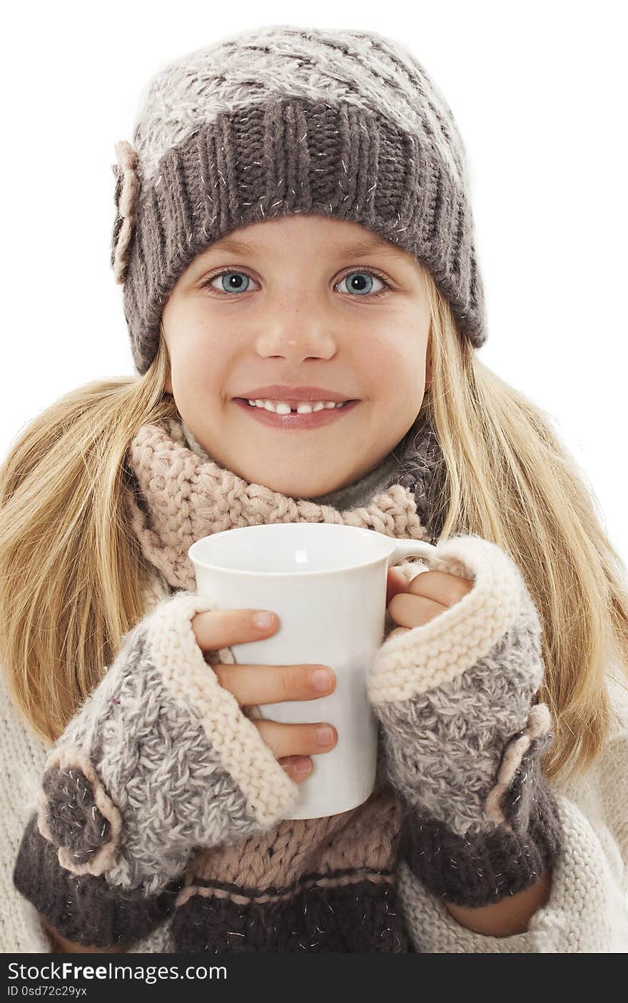 Smiling little girl with a white cup of hot drink. Winter style, Isolated on white background