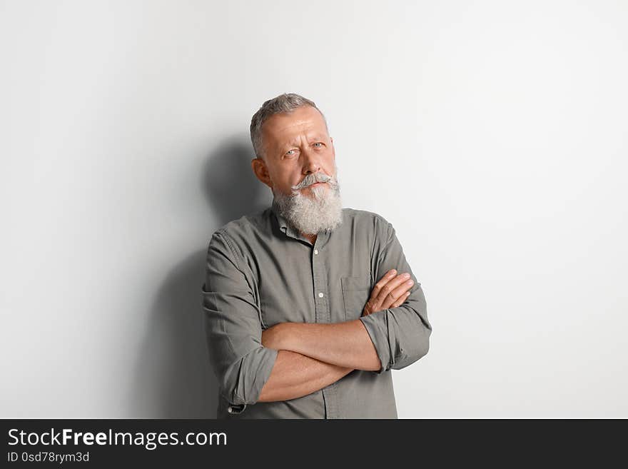 Portrait of handsome senior man on white background