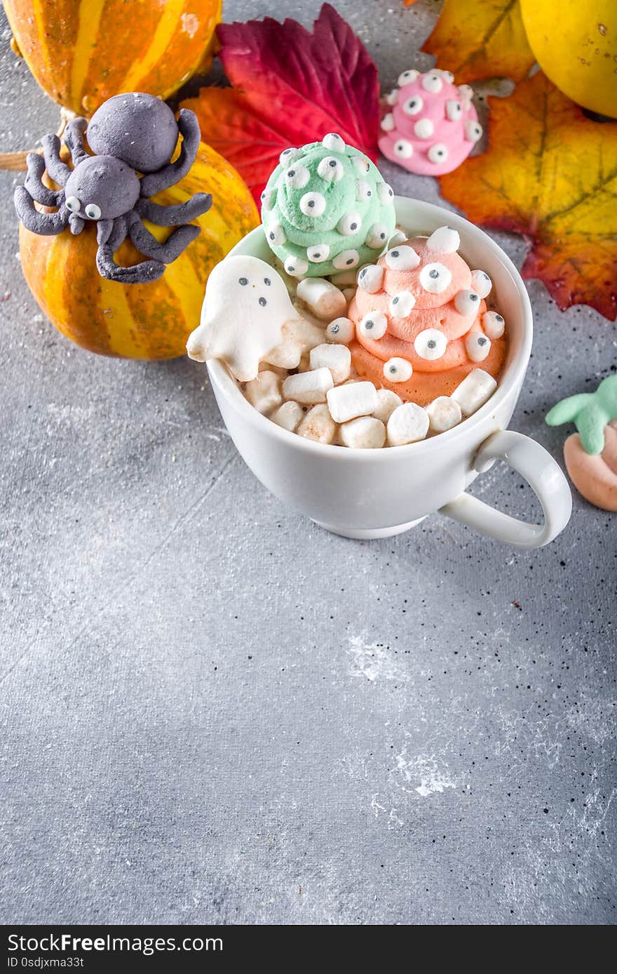 Halloween hot chocolate mugs with funny marshmallows - jack o lantern pumpkins, ghost, monsters, spiders. Halloween hot chocolate mugs with funny marshmallows - jack o lantern pumpkins, ghost, monsters, spiders