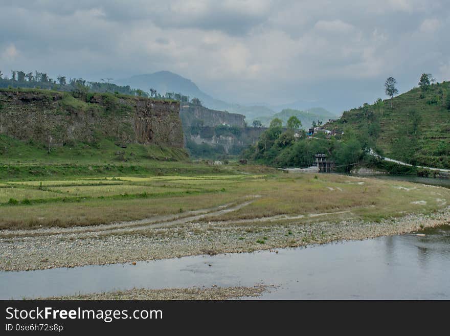 Beautiful landscape view of high hill above river at Himalaya mountains in Nepal