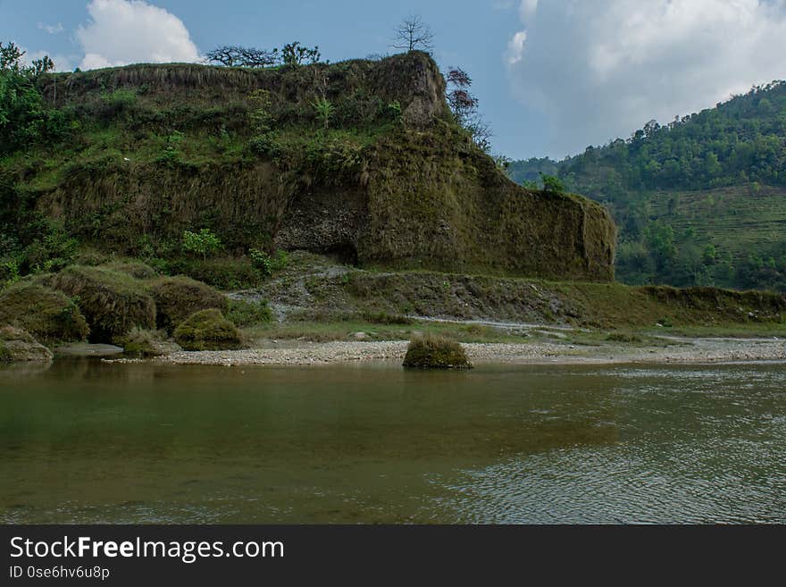 Beautiful landscape view of high green hills above river at Himalaya mountains in Nepal