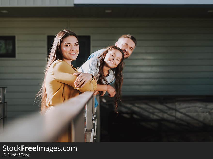 Happy young family is having leisure together