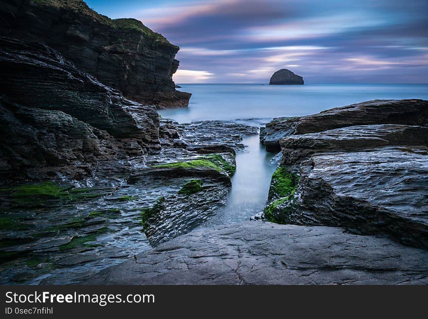 Trebarwith strand in north cornwall at sunrise is a beautiful coastal scenery landscape with amazing colours