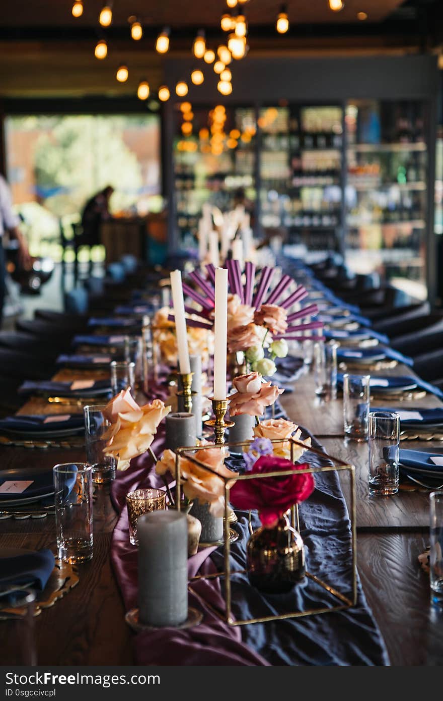 Luxury place for the amazing wedding party. Luxurious decor on the wedding table. candles, flowers, gold and blue elements