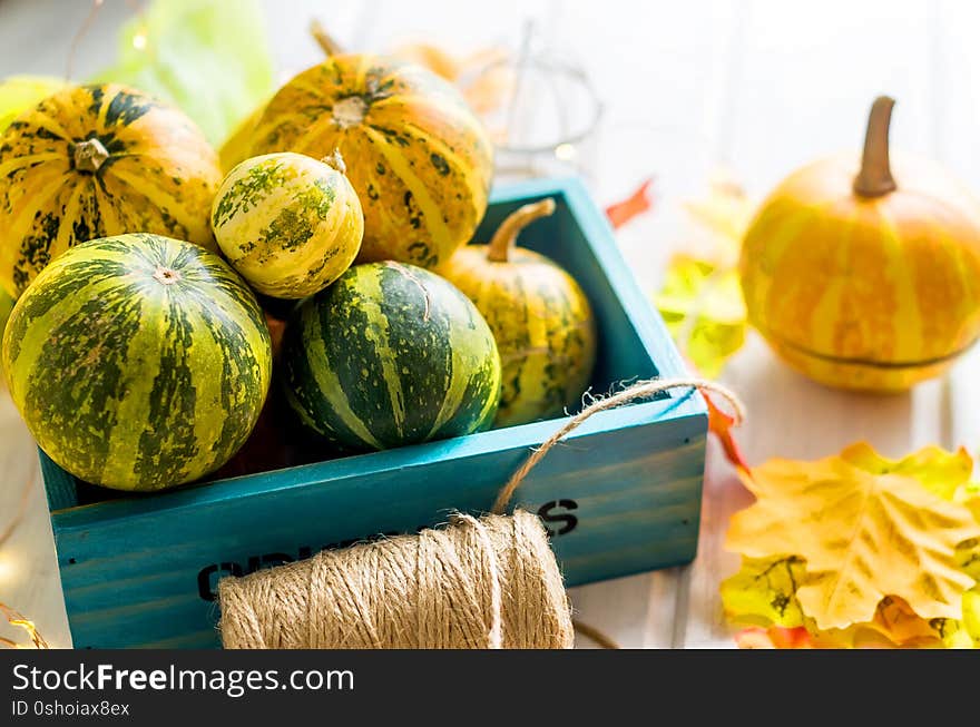 autumn background with pumpkins and leaves and candle