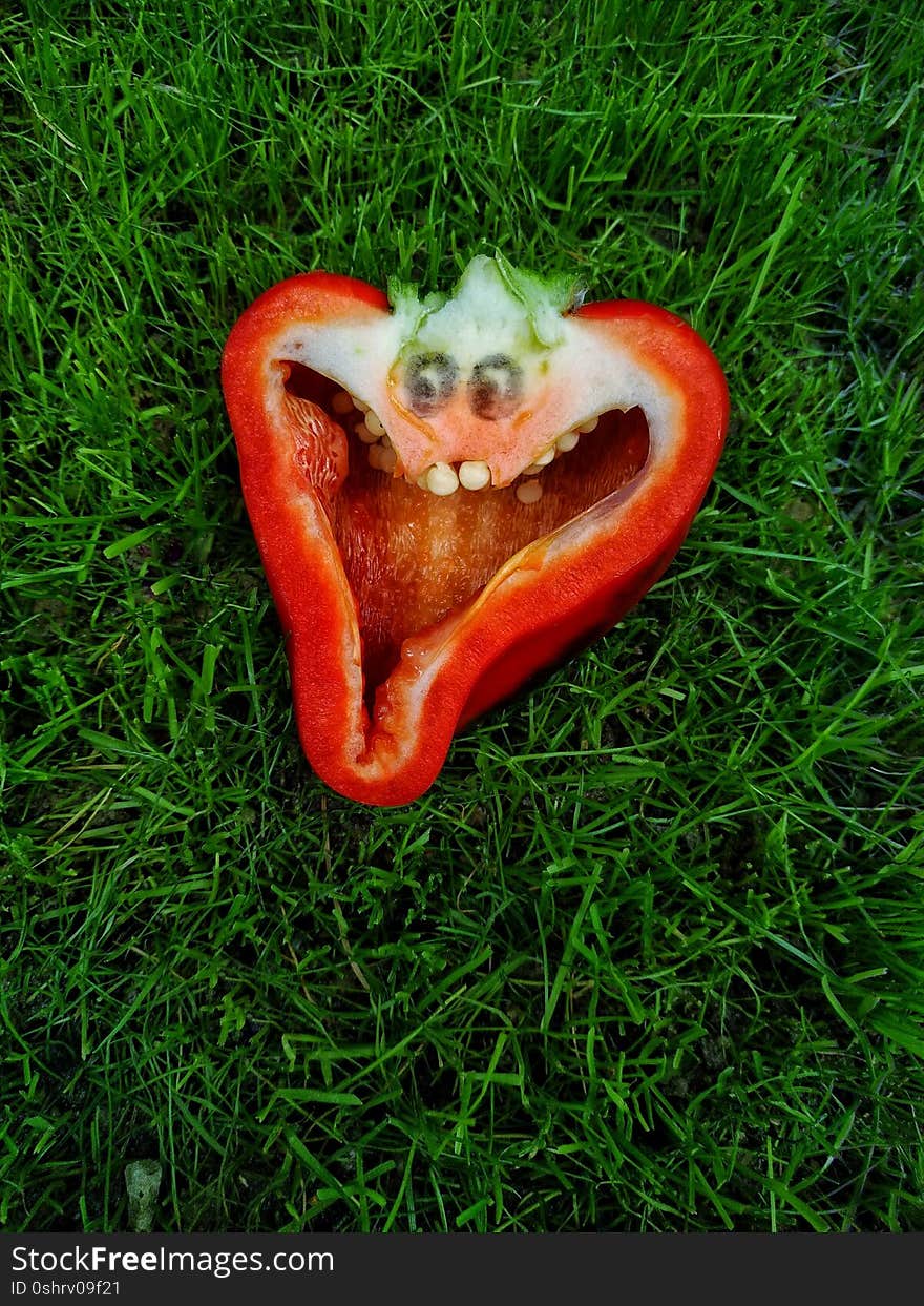 Red cheerful pepper with eyes