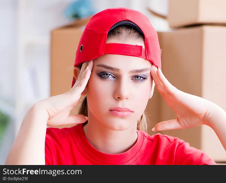 Young woman delivering boxes of personal effects