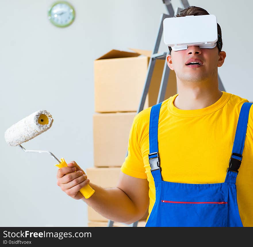 The painter contractor working with virtual reality goggles