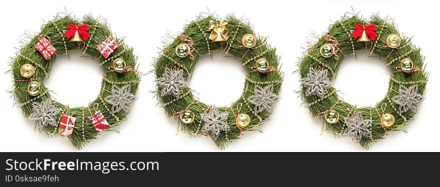 Three CHRISTMAS wreaths on a white background, copy space, close up. Three CHRISTMAS wreaths on a white background, copy space, close up