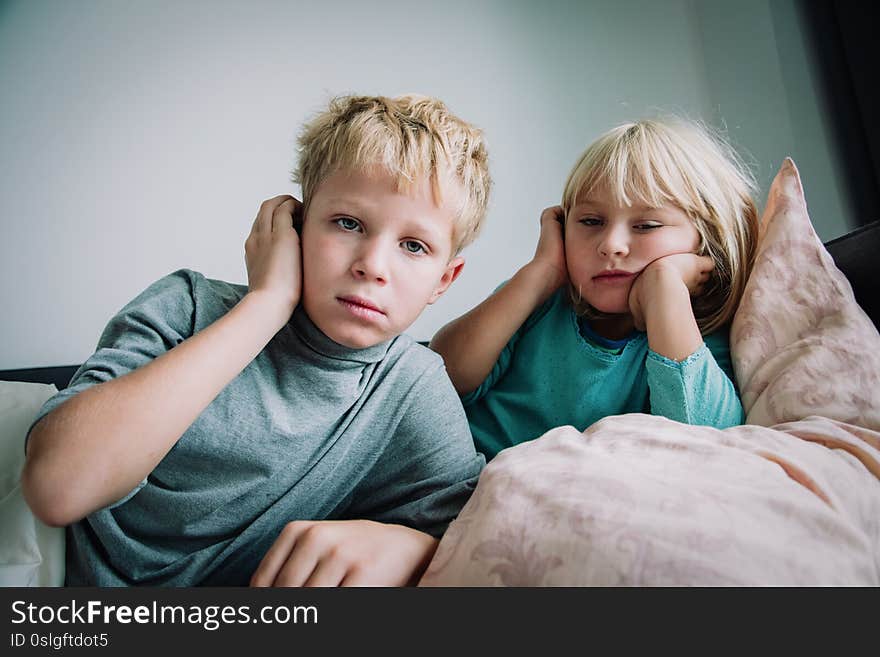 Sick kids with fever at home, children with headache, virus or infection, pain concept. Sick kids with fever at home, children with headache, virus or infection, pain concept