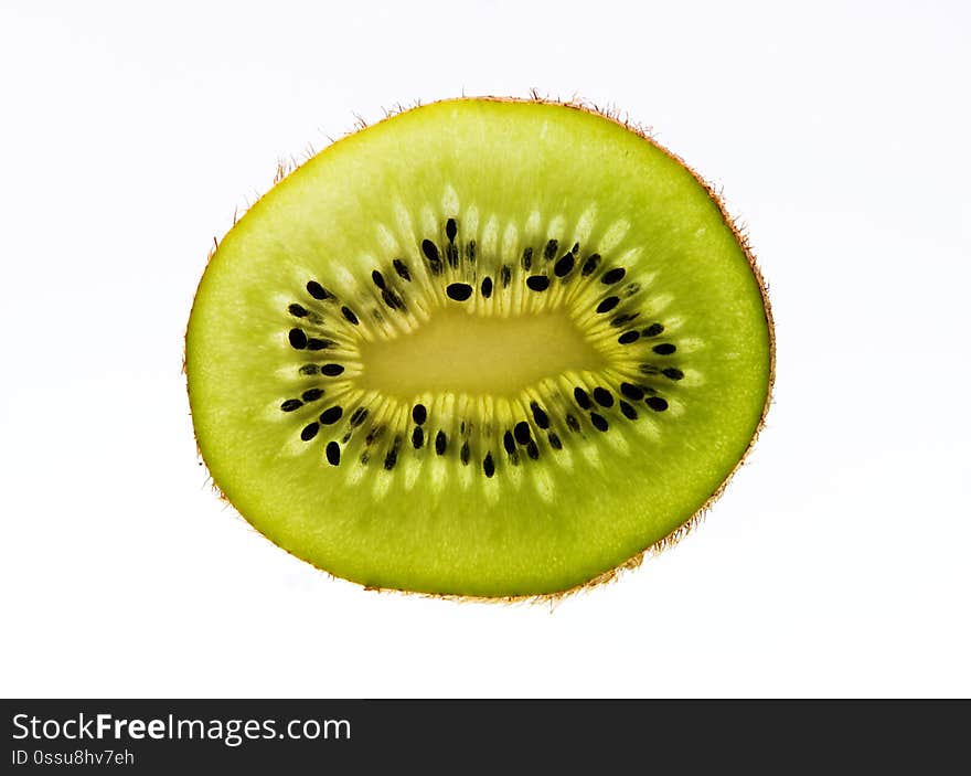 Slice of a Kiwi on white Background by Johann Piber / piber.cc. Slice of a Kiwi on white Background by Johann Piber / piber.cc