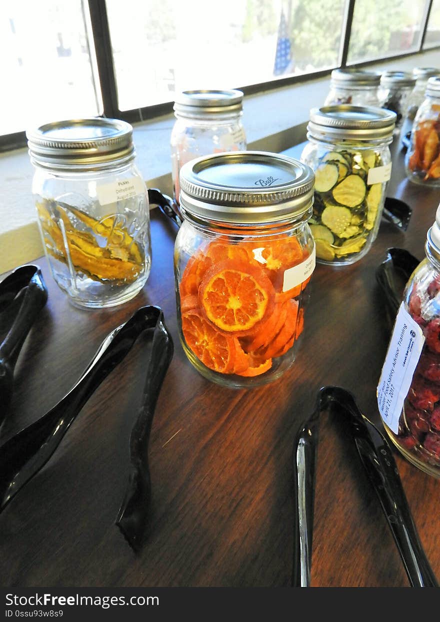 Dried fruits and vegetables with tongs