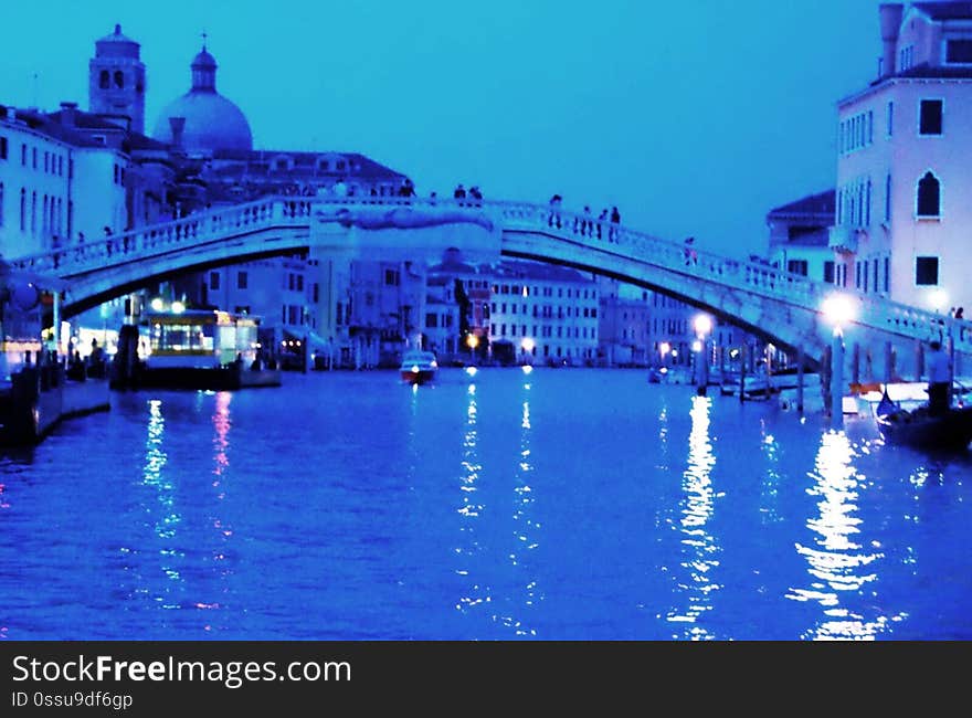 The water streets of Venice are canals which are navigated by gondola&#x27;s or other small boats. During daylight hours the canals, bridges, and streets of Venice are full of tourists eager to experience the romance of this great travel destination. As night engulfs the town, tourists enjoy some fine dining at one of the many restaurants, leaving the waterways and streets quiet. The water streets of Venice are canals which are navigated by gondola&#x27;s or other small boats. During daylight hours the canals, bridges, and streets of Venice are full of tourists eager to experience the romance of this great travel destination. As night engulfs the town, tourists enjoy some fine dining at one of the many restaurants, leaving the waterways and streets quiet.