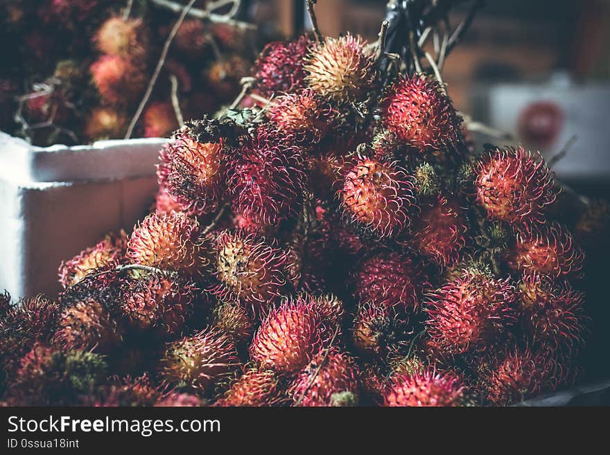 Rambutan fruits on the asian night market. Bali island. Indonesia.