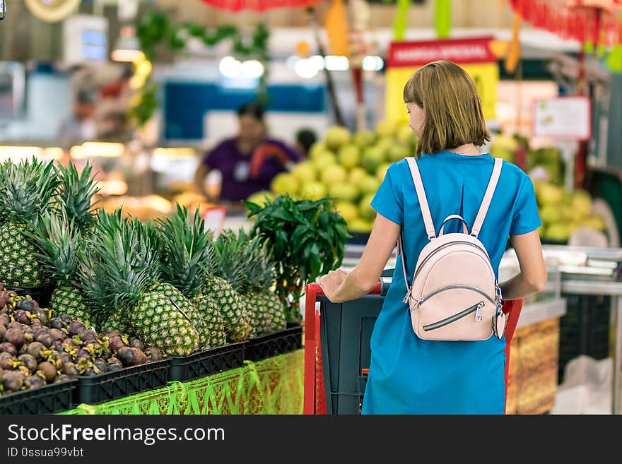 Young woman in supermarket on Bali island. Indonesia.