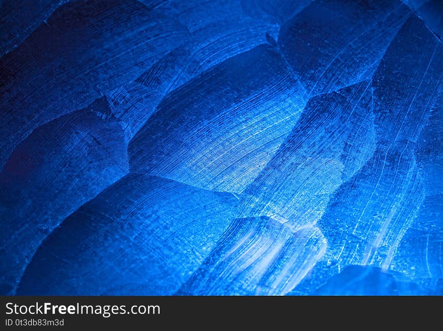 ice bluе color backlight, Abstract background of ice texture from ice cave in winter