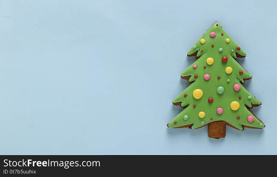 Edible Christmas tree, gingerbread, Happy New Year, blue background, Copy space