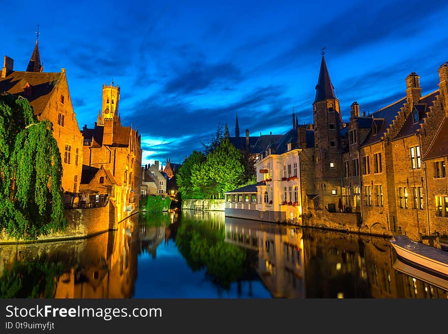 Belgium, Brugge, ancient European town with stone buildings on river, night view, glassy water surface. Tourism and travels, famous europe landmark, popular places, West Flanders. Belgium, Brugge, ancient European town with stone buildings on river, night view, glassy water surface. Tourism and travels, famous europe landmark, popular places, West Flanders