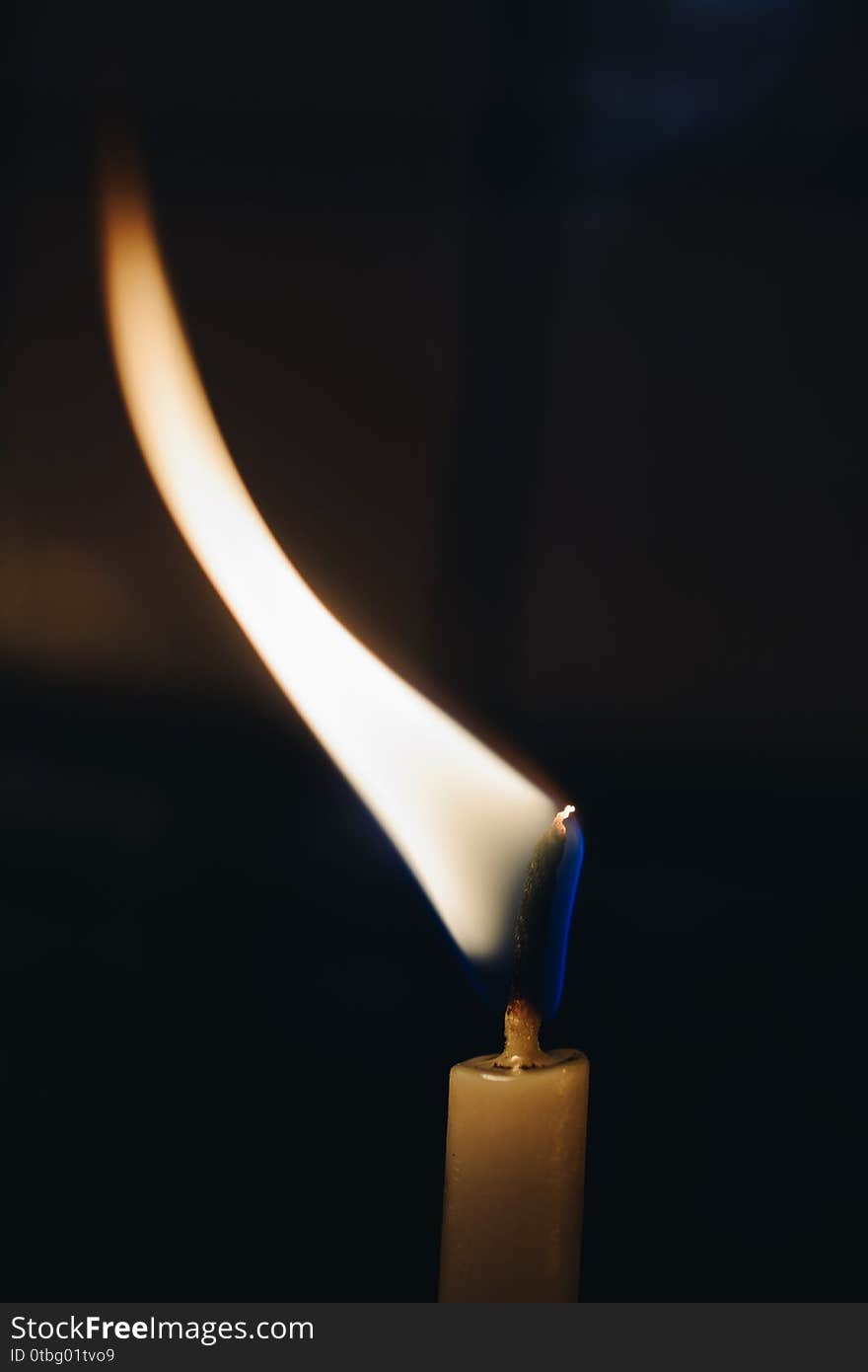 Burning candle making light in view as a background