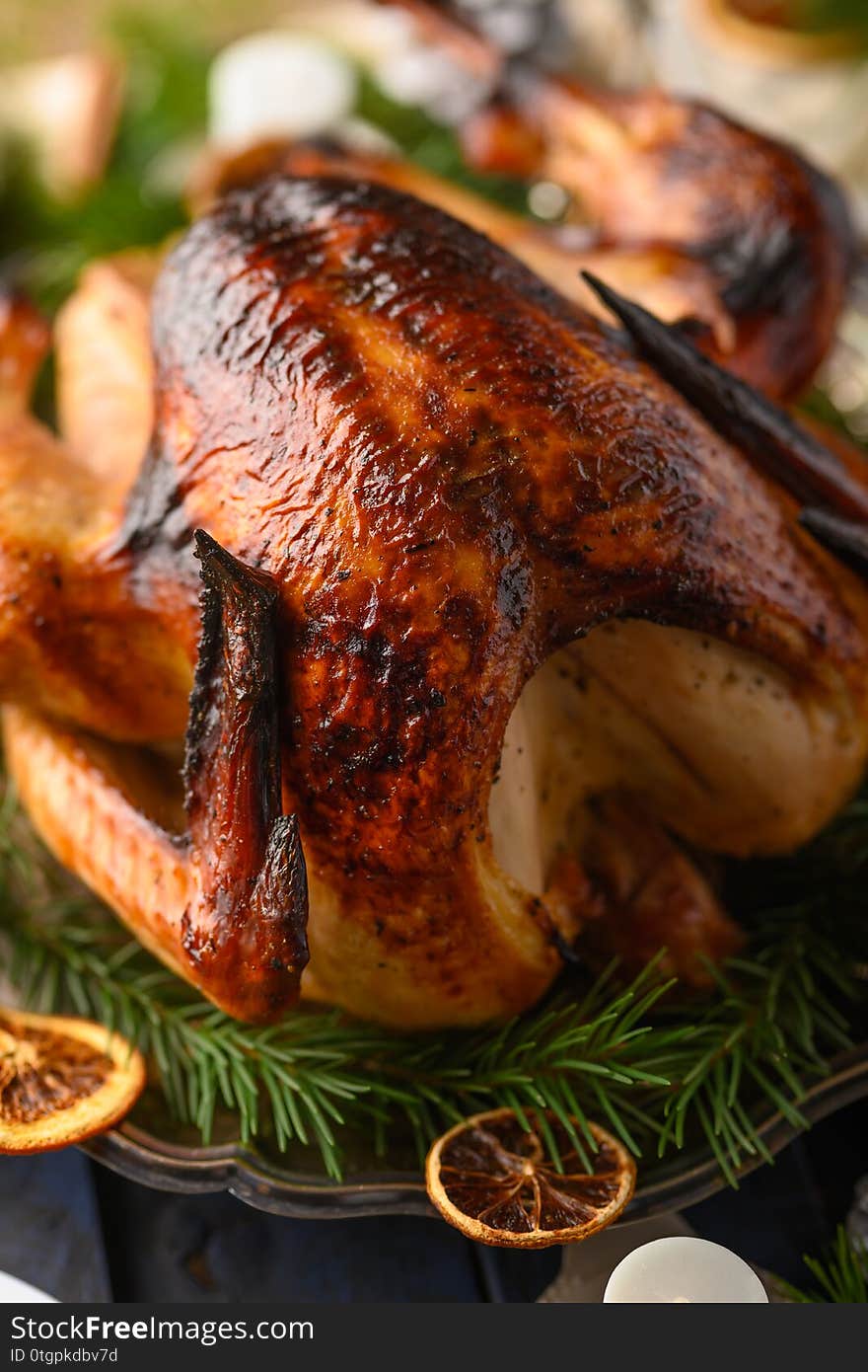 Christmas table, festive baked turkey, and served table. Vertical frame.