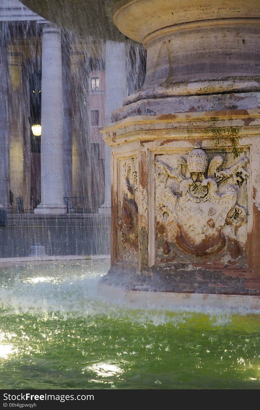 Fountain of Bernini and the colonnade  in St. Peter`s Square in the Vatican City