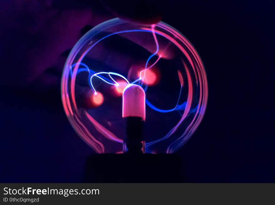 Attraction of charge to the fingers on a ball of a tesla coil. Statics