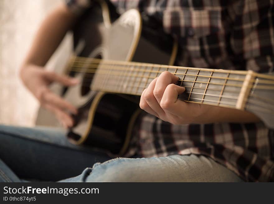 Guitarist  playing  guitar on the room