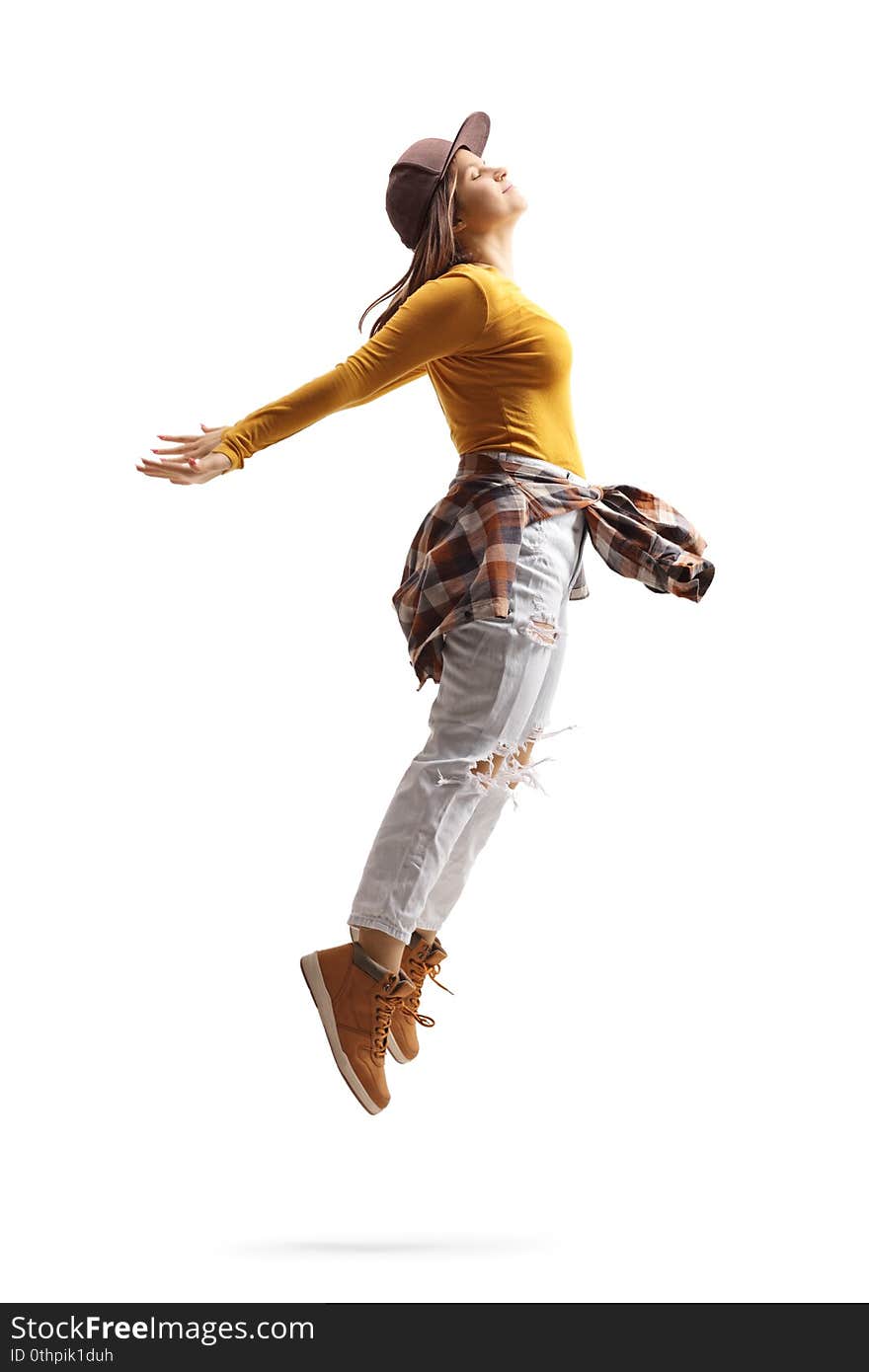 Female street dancer in a jumping pose isolated on white background