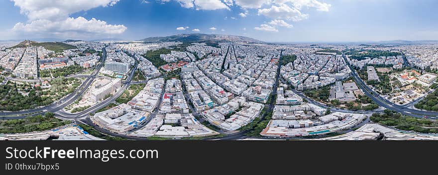 Aerial panoramic drone shot of west Athens with Lycabettus hill , Garden Byzantine , war musuem