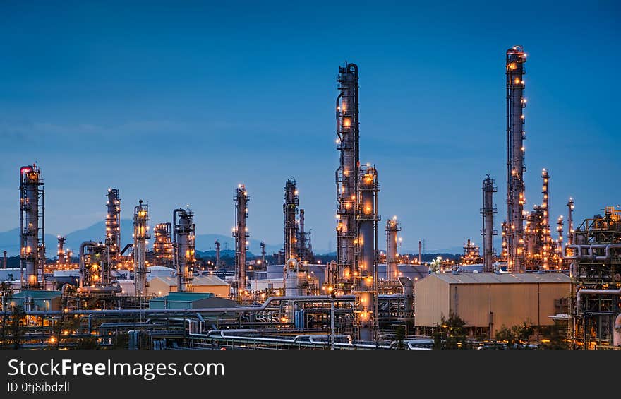 Oil and gas refinery plant or petrochemical industry on blue sky twilight background, Manufacturing petroleum industrial. Oil and gas refinery plant or petrochemical industry on blue sky twilight background, Manufacturing petroleum industrial