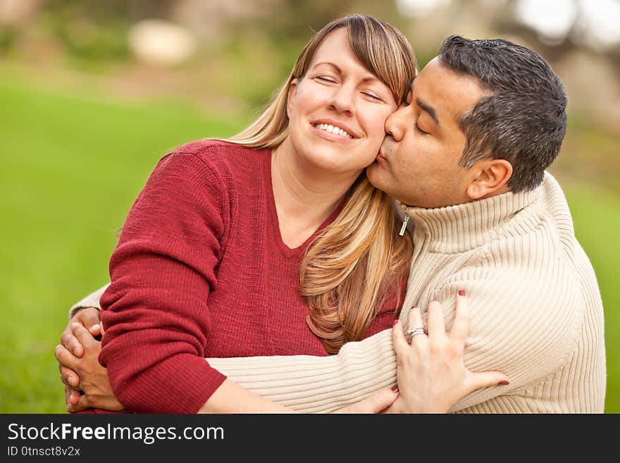 Affectionate Mixed Race Couple Portrait in the Park