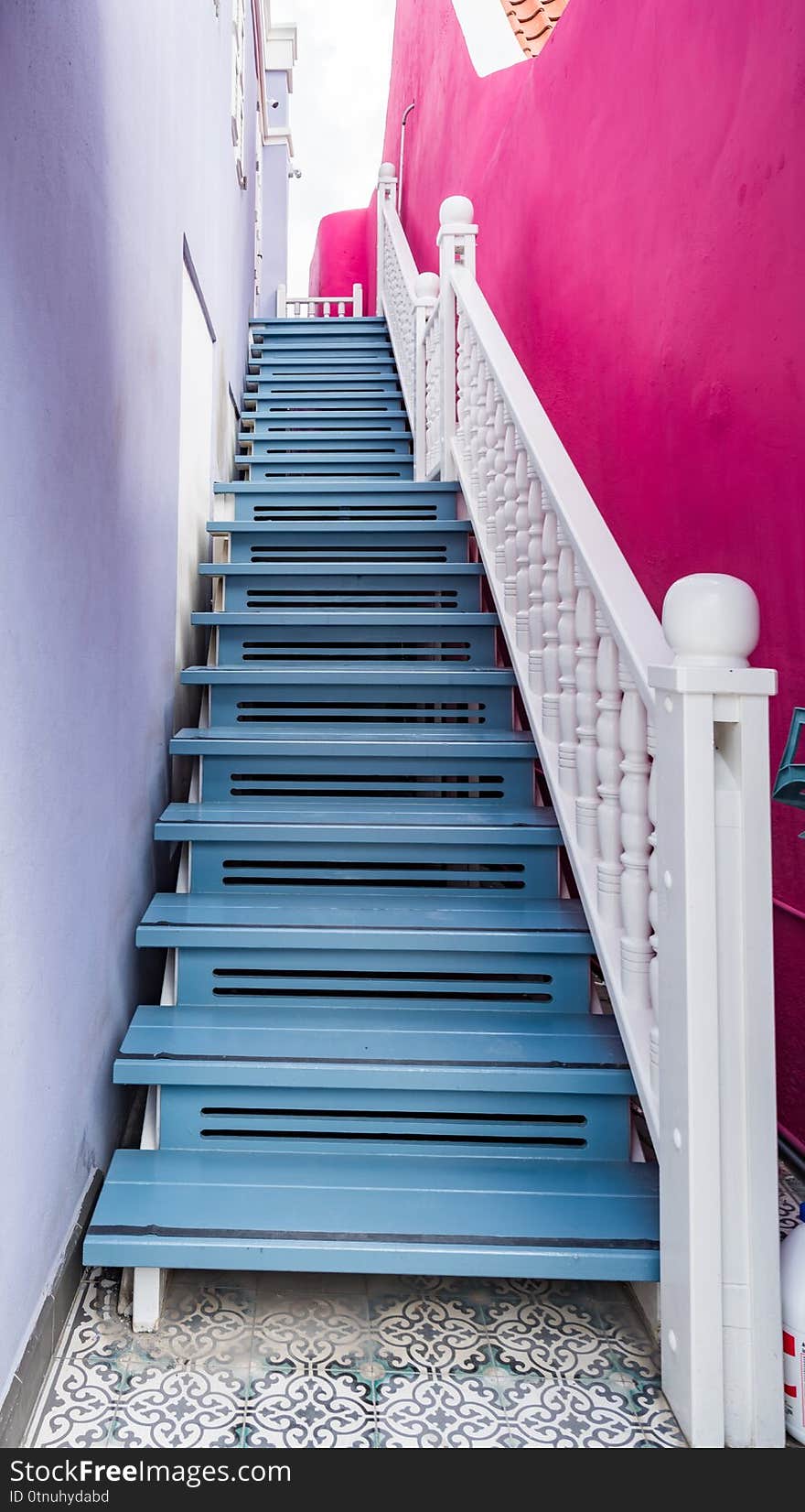 Bright blue wooden staircase and steps