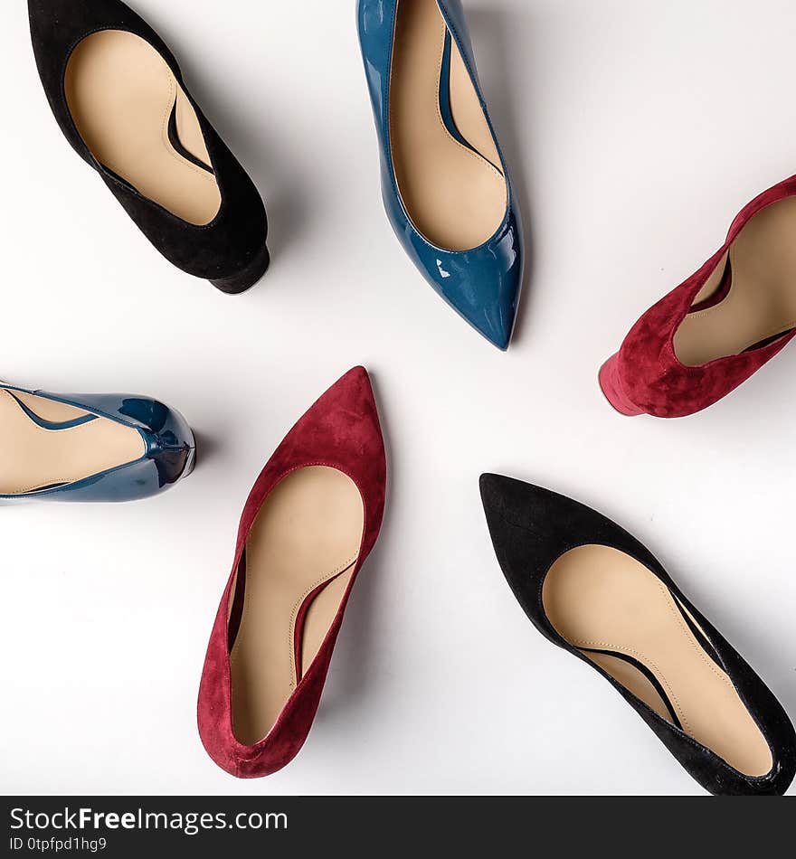 Footwear for women. High heels. Top view different colors of high heels. Fashion and beauty concept.