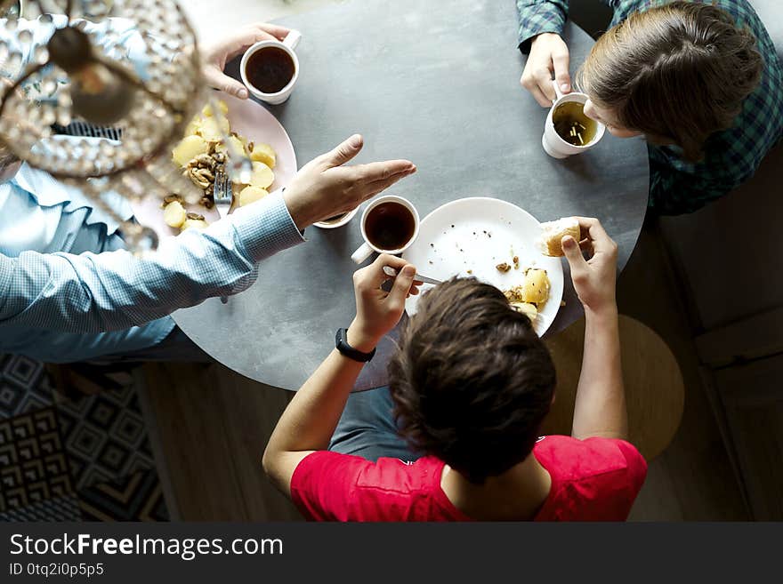 Family breakfast at the oval table by the window